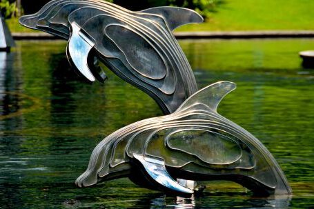 Garden Pond Design - Gray and Brass Metal Dolphin Pool Decor