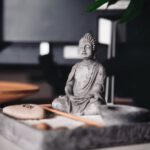 Feng Shui Garden - a buddha statue sitting on top of a table